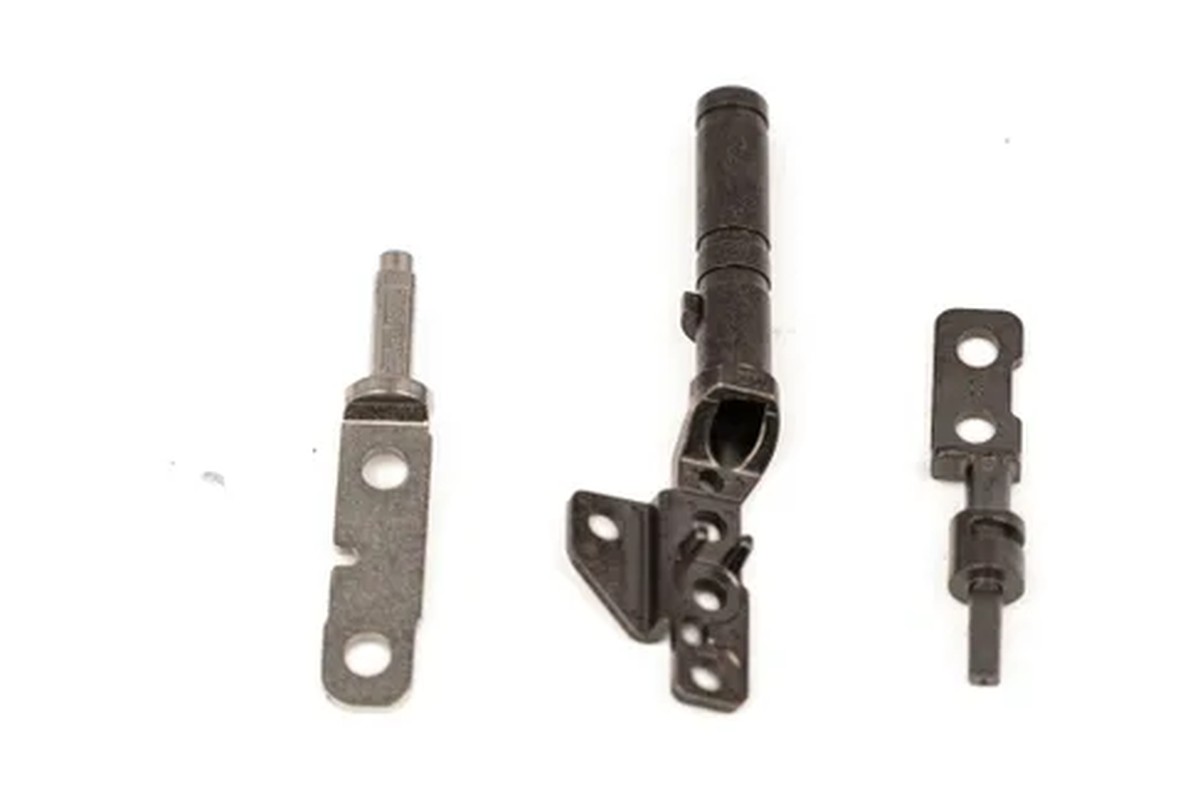 Representative SINTS small structural metal components; geometry reference only, not the part described in this note
